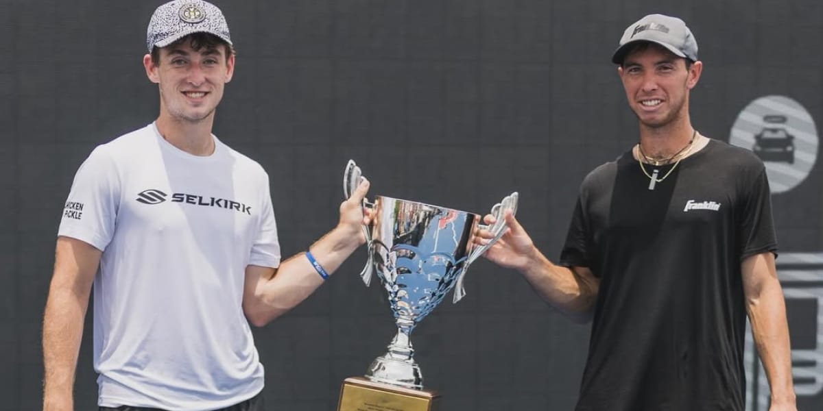 Dyland Frazier and JW Johnson holding a trophy at a PPA Tournament